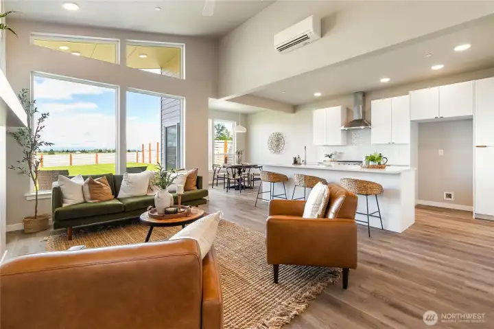 View of the spacious open floor plan. Many windows flood this home with light