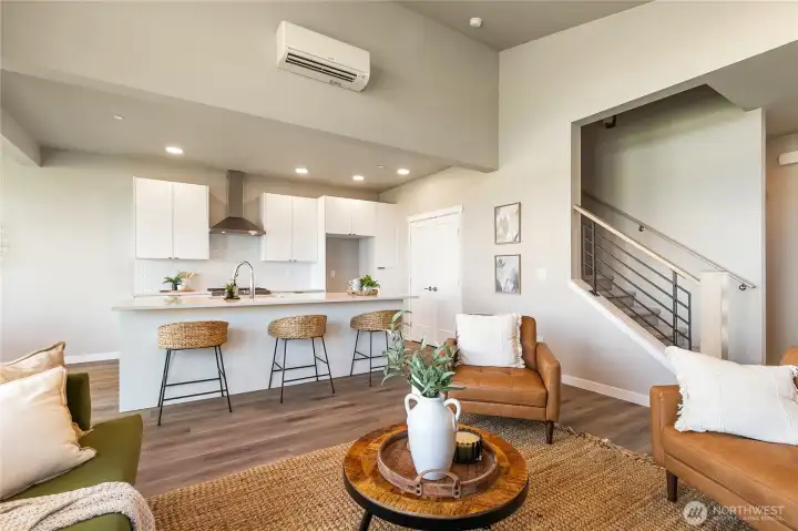 View of living/kitchen area looking back at staircase