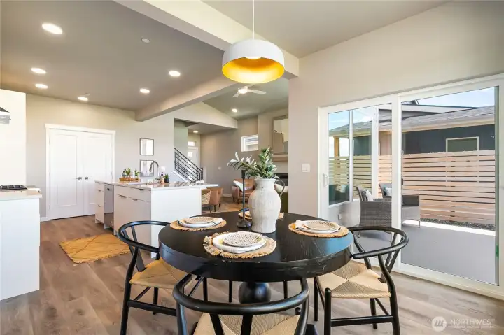 View of dining area with slider to patio and backyard