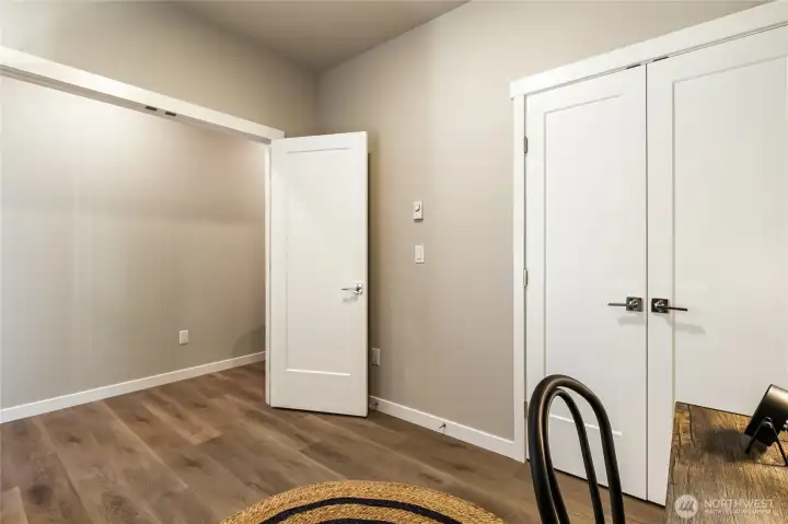 Main floor bedroom #2 with French doors to closet