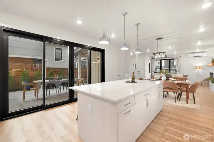 European slider doors and extra-tall windows invite abundant natural light