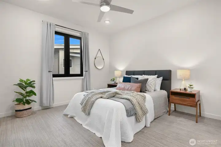 Primary ensuite featuring high ceilings for an open and airy feel