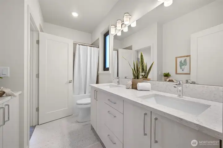 Guest ensuite bath featuring luxurious details