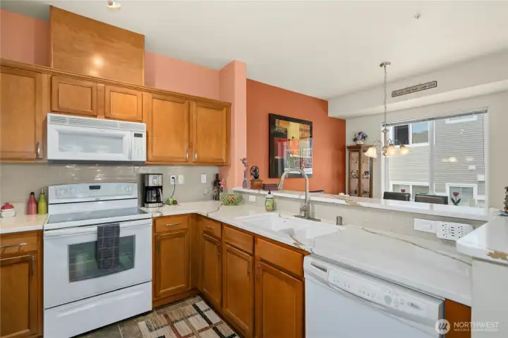 Kitchen features quartz counters.