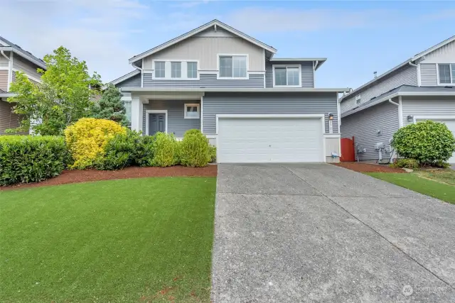 Gorgeous home with low-maintence yard featuring aritificial turf. No need to water!