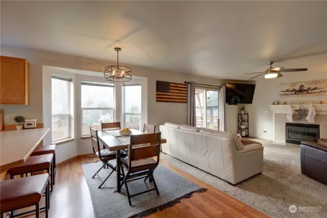 Kitchen eating space plus the adjoining family room features a gas fireplace.  Sliders lead out to the patio and backyard.