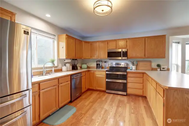 Another view of the open kitchen.  The range features a double oven with Air Fry feature!