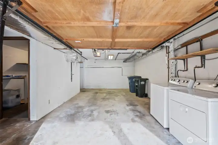 1 car attached garage with laundry and storage off to the side