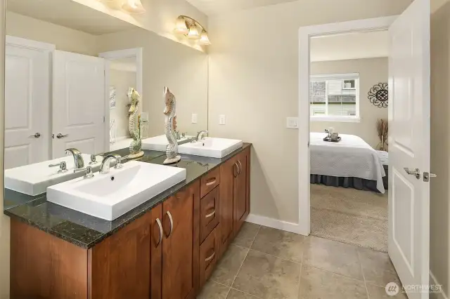 Dual sink vanity in bathroom the primary bathroom.