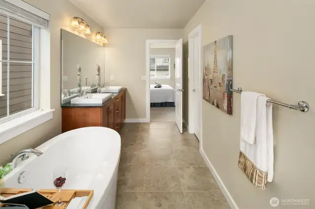 The primary bathroom also features a soaking tub and separate shower.