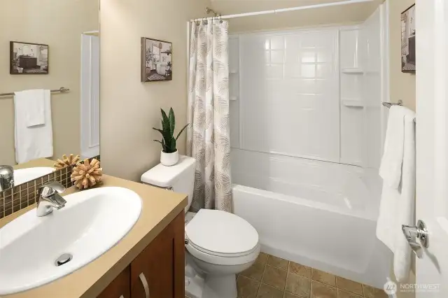 Full bath with tub/shower combo.