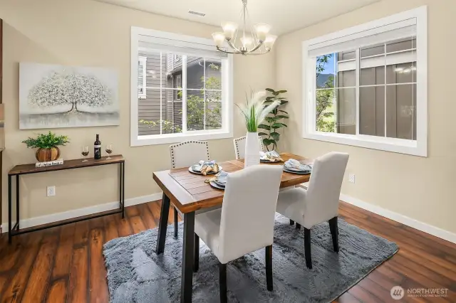 Light-filled dining room area accented with windows.