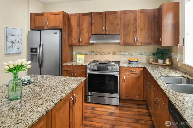 Slab granite countertops add to the appeal of this kitchen.