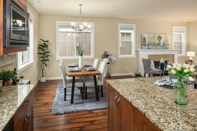 The open concept kitchen flows to the dining area and living room area.