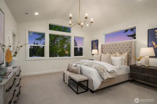 Designer primary suite with five-piece bath with heated floors