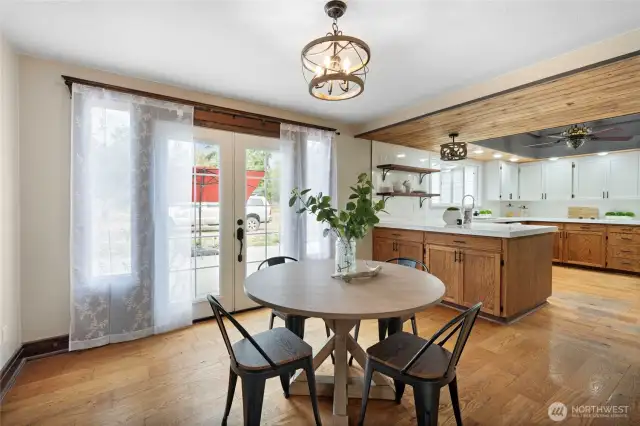 Dining room with French doors to the back patio.