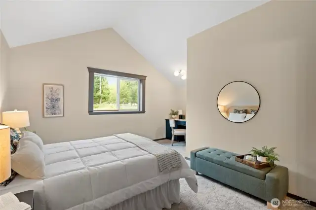 Primary bedroom 2 offers vaulted ceilings, tons of space, and a study nook.