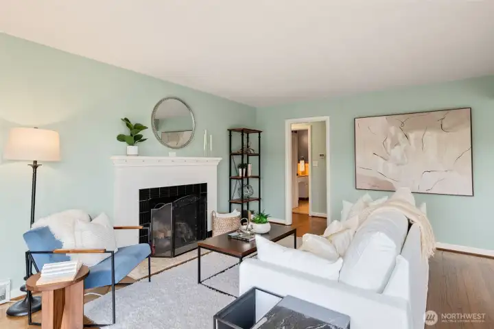 Hardwood floors and an art deco fireplace- Charm and warmth!