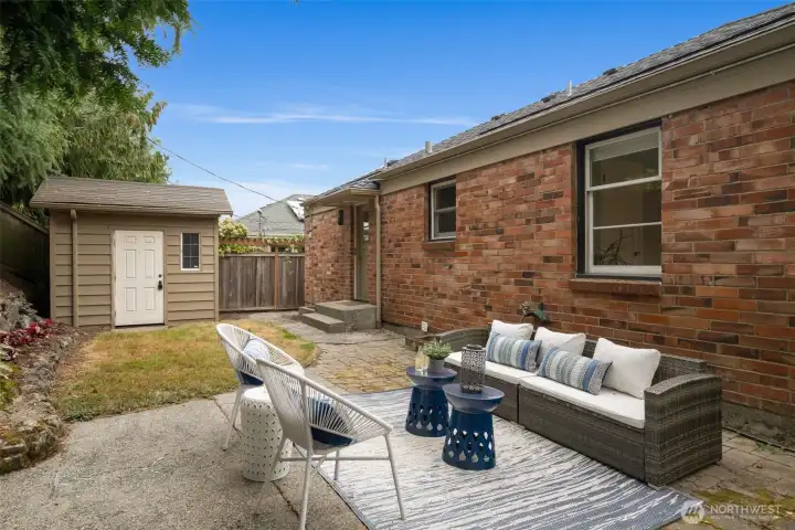 YUP- there's a brick back yard patio and storage shed too. So much privacy and tranquility