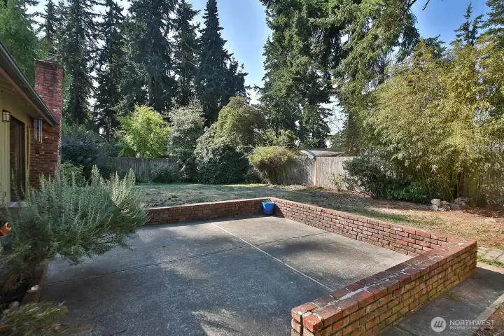 Another view of your spacious level fenced yard.
