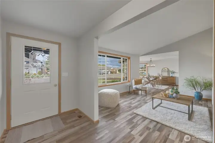 As you enter, you are welcomed into a light and bright living room with vaulted ceilings. LVP flooring throughout!