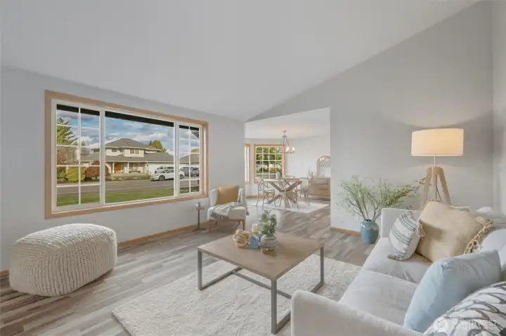 Large windows, soaring ceilings, and LVP floring throughout.