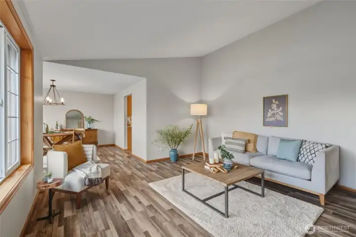 Just through the living room is an elegant dining space full of natural light.