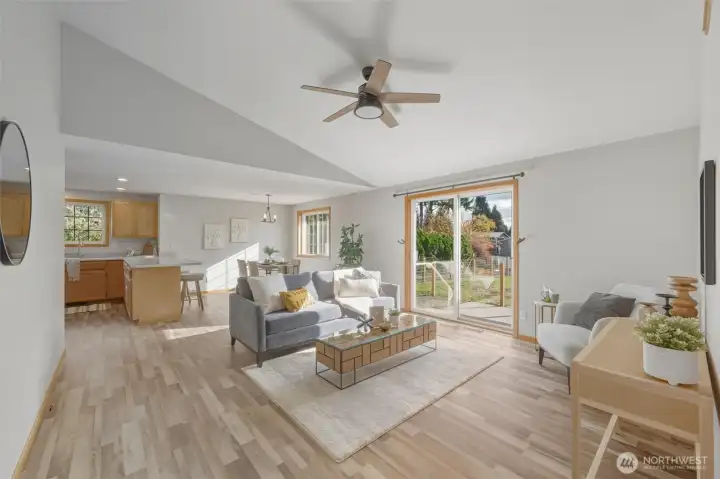 Spacious south-facing (sunny!) family room with soaring ceilings and sliding glass doors out to the patio & backyard.