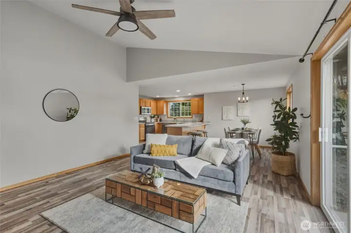 Back into the family room, looking at the kitchen and spacious breakfast nook.
