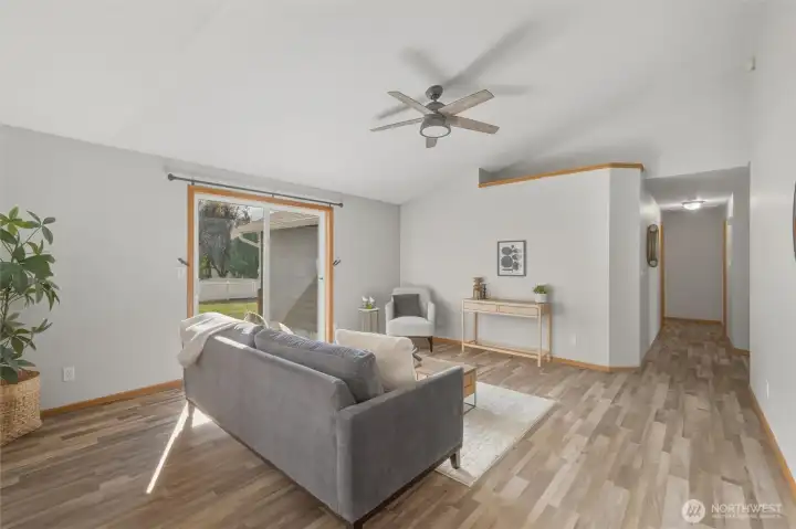 Down the hallway (on the right side of this photo), you'll find a full bathroom, a laundry room, and 3 bedrooms.