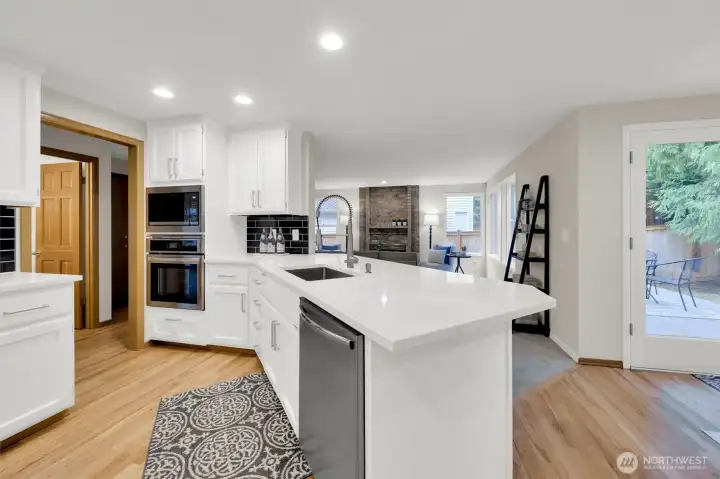Picture of new quartz counter, with nice workspace & overhang and quality sink. New dishwasher.