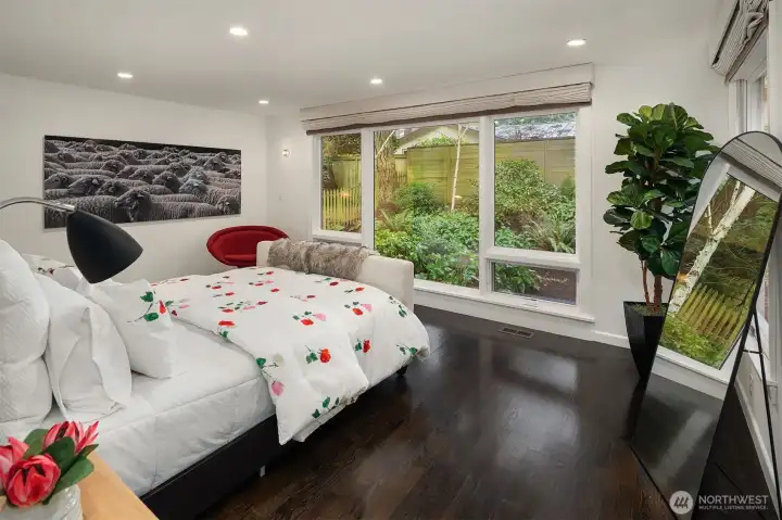 Primary Bedroom offers custom electric window coverings