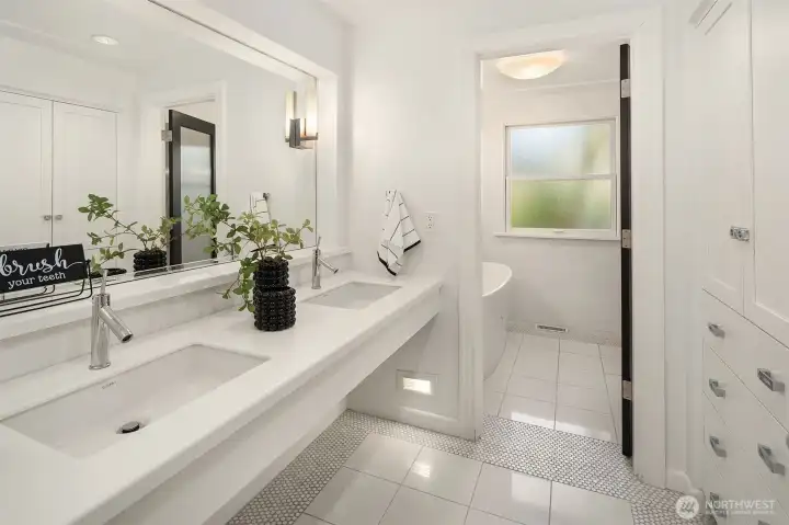 Floating dual vanity with custom cabinets for ample storage