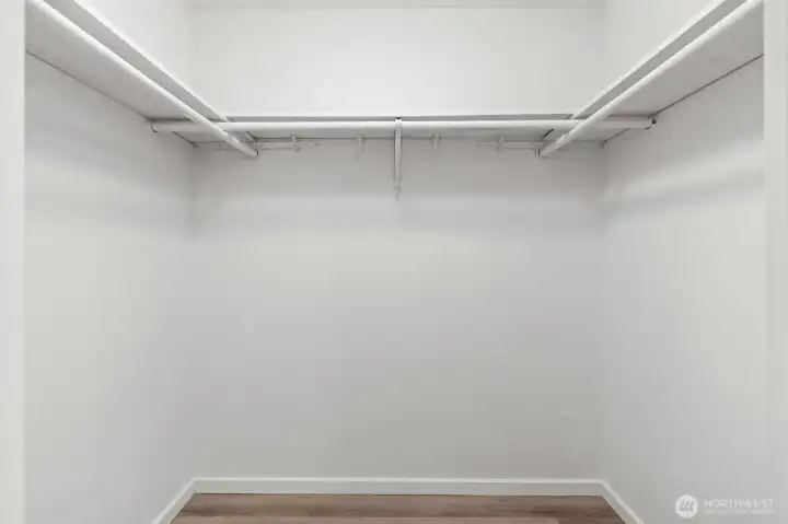 Primary bedroom walk-in closet