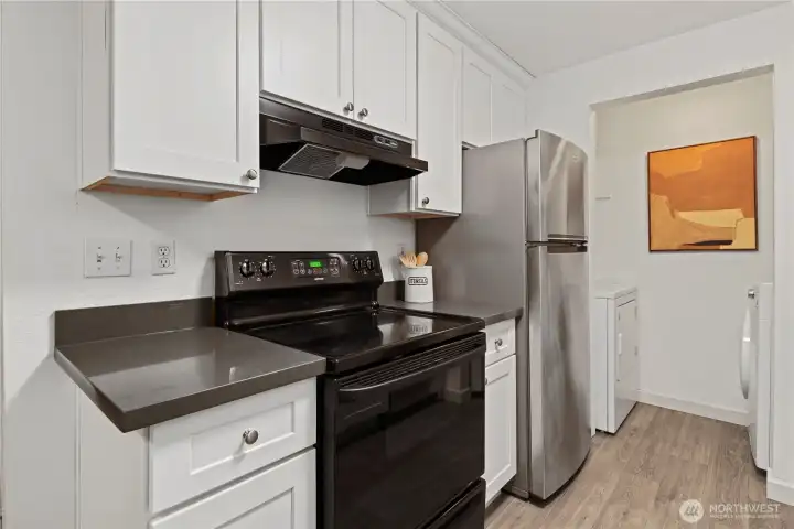 Stainless steel fridge and dishwasher. Laundry in unit as well.