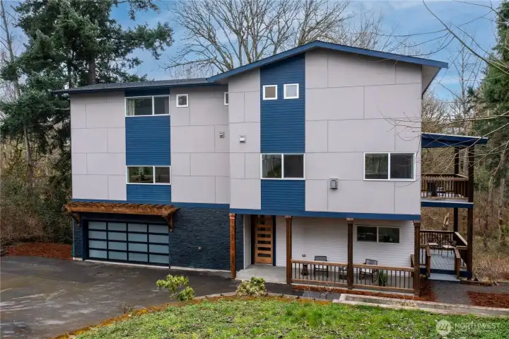 Front view with porch and 2 side decks