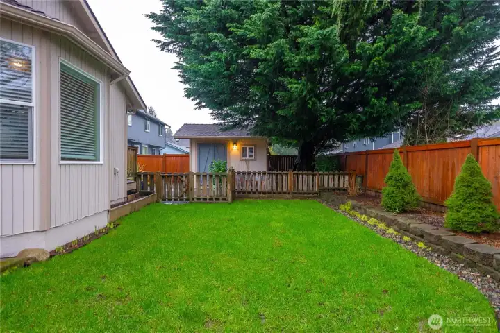 Fully fenced backyard, offering privacy and a safe space for kids and pets.