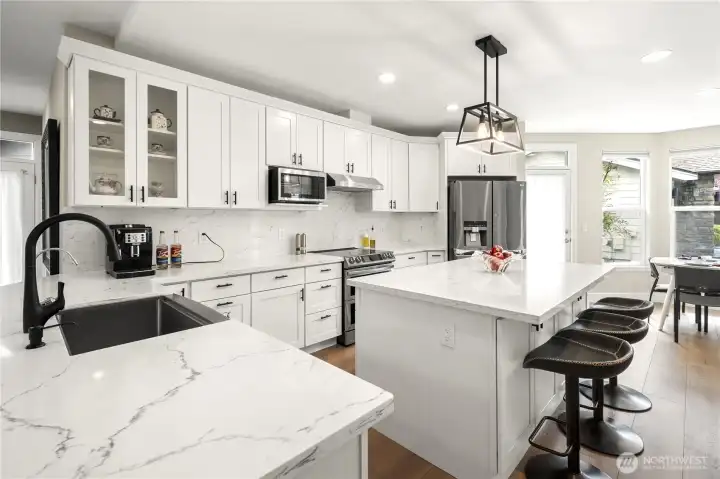 Cabinets under both sides of island and convenient pull out drawers