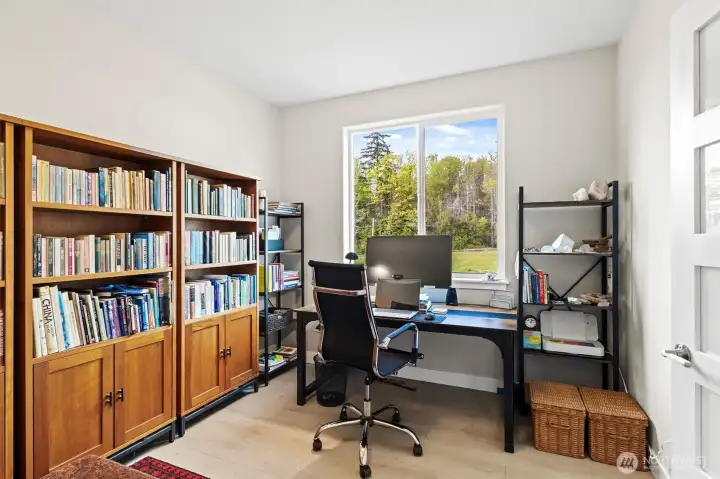 Office off the entrance that overlooks the community green space