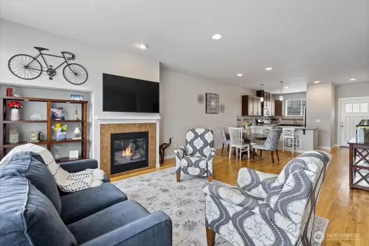 Cozy tile surround gas fireplace in great room