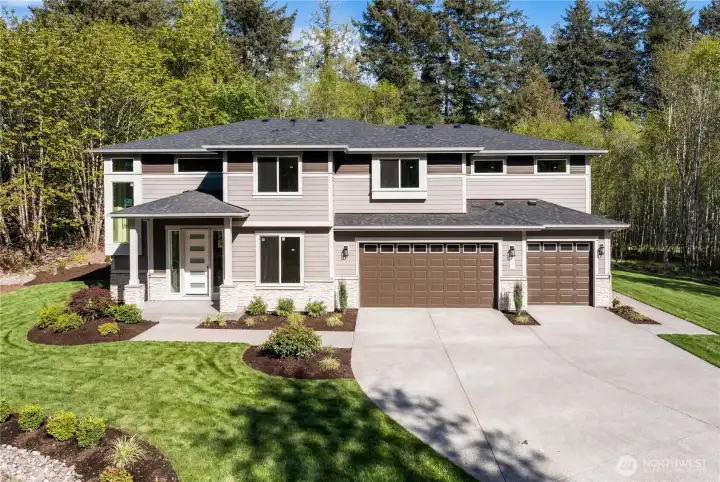 Photo is of actual home, yard is digitally altered but landscaping will be completed similar.