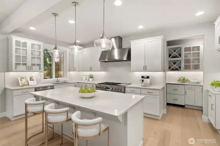Functional kitchen with ample with soft close cabinets and designer tile backsplash.