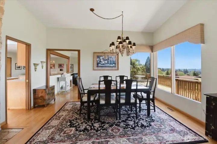 Formal dining area with picture windows.