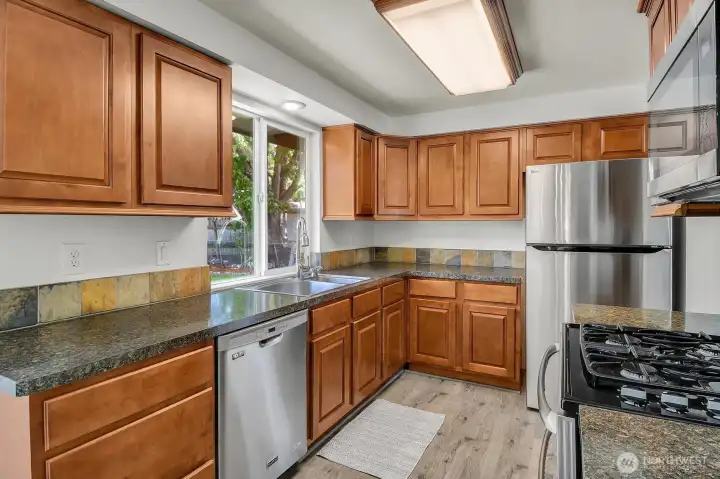 Tastefully updated kitchen with newer appliances for a fresh, modern feel. Tastefully updated kitchen with newer appliances for a fresh, modern feel.