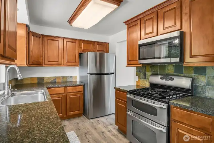 Tastefully updated kitchen with newer appliances for a fresh, modern feel. Tastefully updated kitchen with newer appliances for a fresh, modern feel.