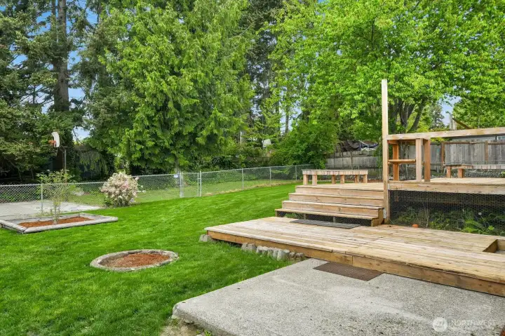 Enjoy a large, level lot featuring garden spaces, mature trees, a cozy firepit area, and an additional gated section with a level pad perfect for entertaining, projects, or creative possibilities. Enjoy a large, level lot featuring garden spaces, mature trees, a cozy firepit area, and an additional gated section with a level pad perfect for entertaining, projects, or creative possibilities.