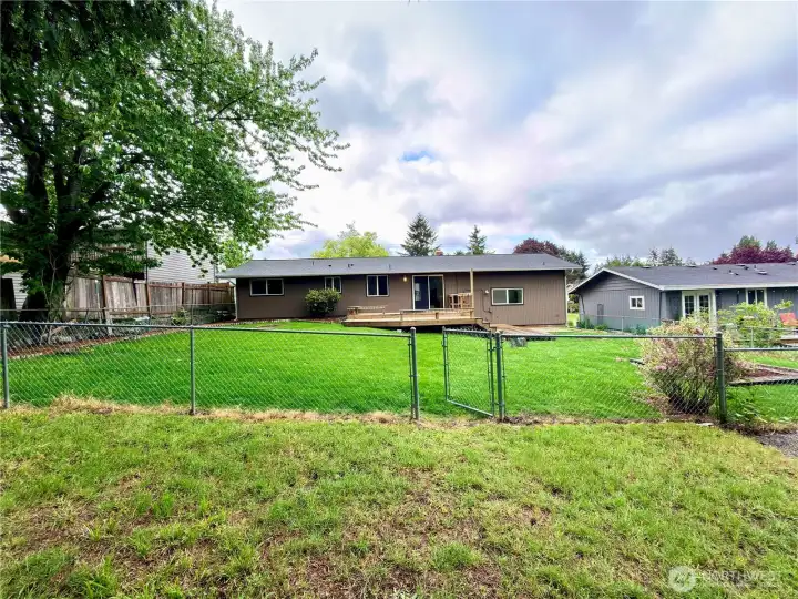 Enjoy a large, level lot featuring garden spaces, mature trees, a cozy firepit area, and an additional gated section with a level pad perfect for entertaining, projects, or creative possibilities. Enjoy a large, level lot featuring garden spaces, mature trees, a cozy firepit area, and an additional gated section with a level pad perfect for entertaining, projects, or creative possibilities.