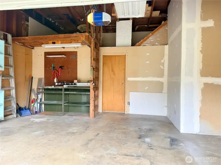 The garage offers a high loft for extra storage and a built-in workbench—ideal for projects, hobbies, or organization The garage offers a high loft for extra storage and a built-in workbench—ideal for projects, hobbies, or organization
