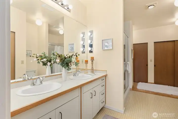 Primary bathroom located directly off the primary bedroom w/walk-in shower, tub and plenty of closet space!