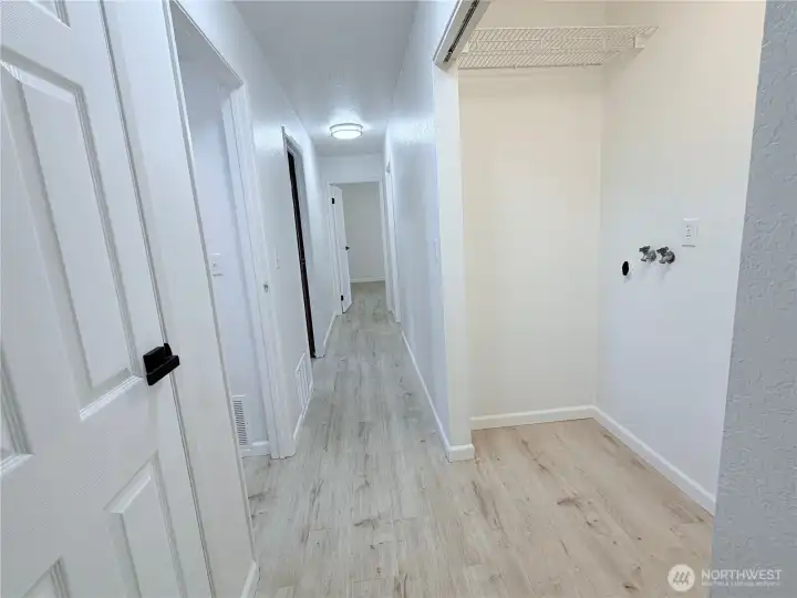 lower level hallway to the garage door and bedrooms